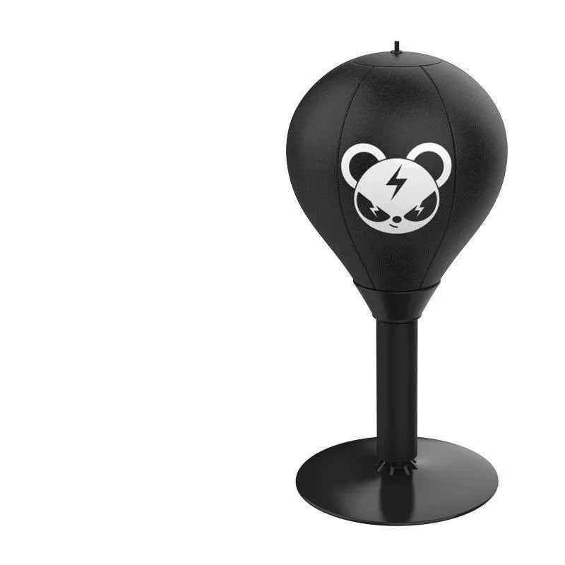 Tabletop boxing speed ball with suction cup base, inflatable PU leather sphere, and pump on a wooden desk.