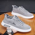 Men's grey canvas casual sneakers with leather lining and round toe design