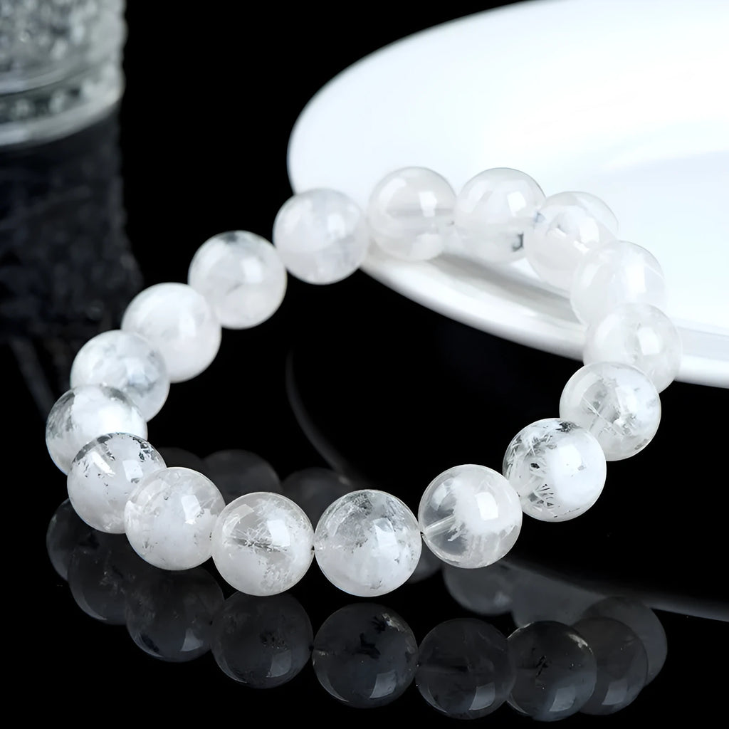 Women's crystal bracelet with round blizzard snowflake beads and geometric Ruyi Xiangyun design.