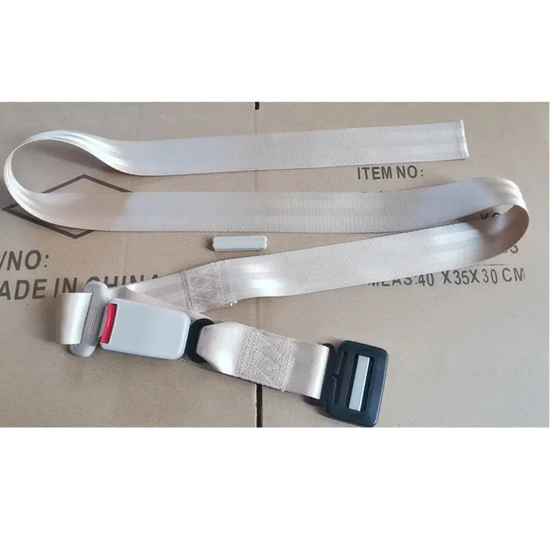 A beige press buckle maternal car seat belt support wrapped around a grey car seat.