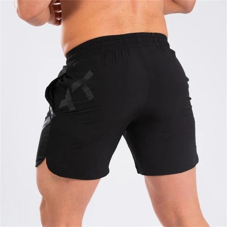 Men's black knee-length running shorts with elastic waist, shown flat for detail.