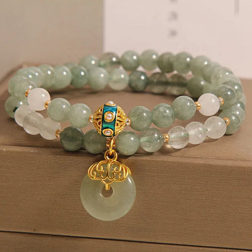 Women's double-layer aventurine jade bracelet with safety buckle and rhinestones.