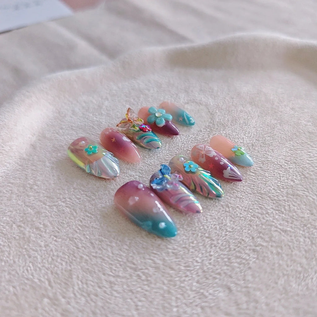 Handmade colourful nail sculpture set with small flower and butterfly designs in four sizes