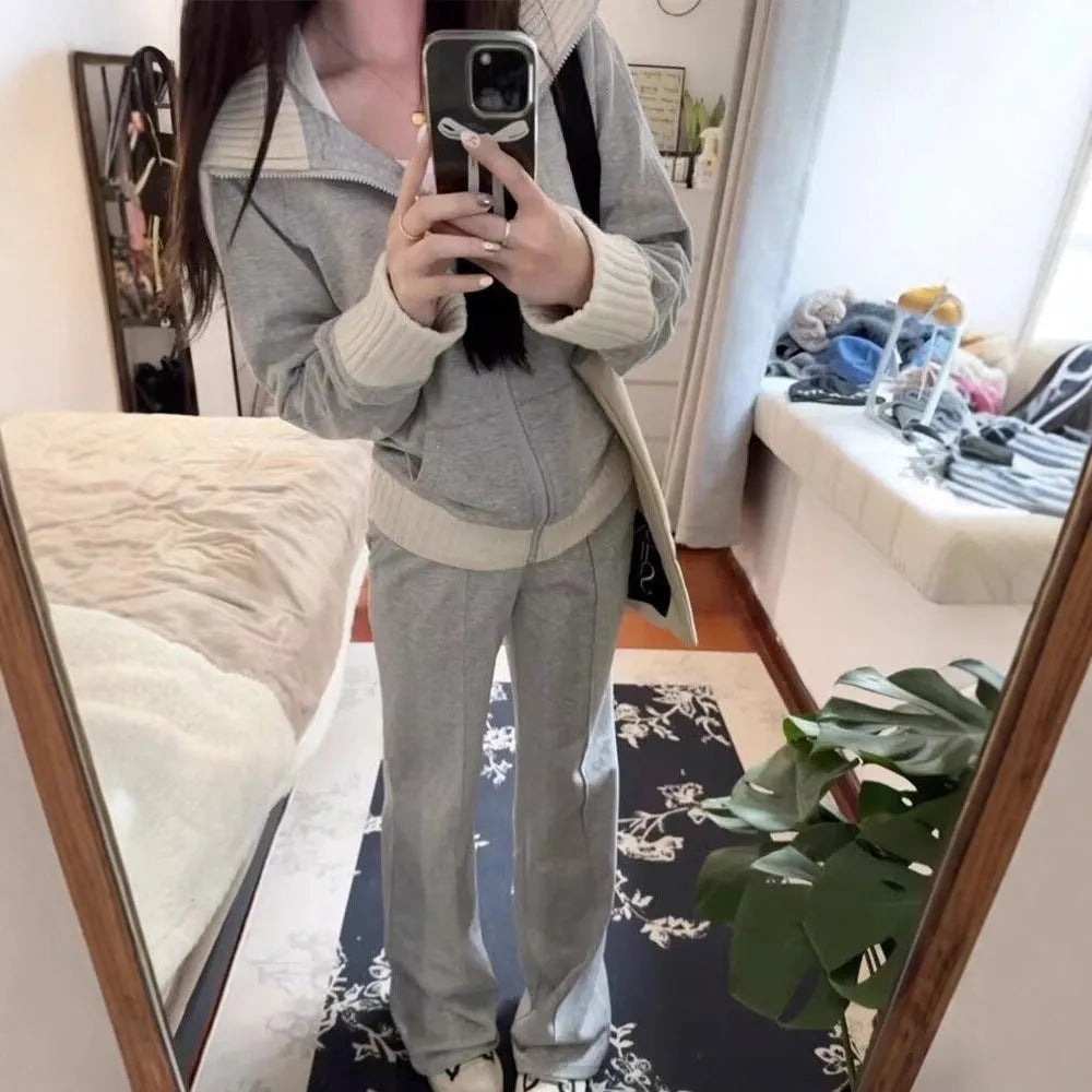Light gray women's casual two-piece set with coat having pockets and wide leg trousers
