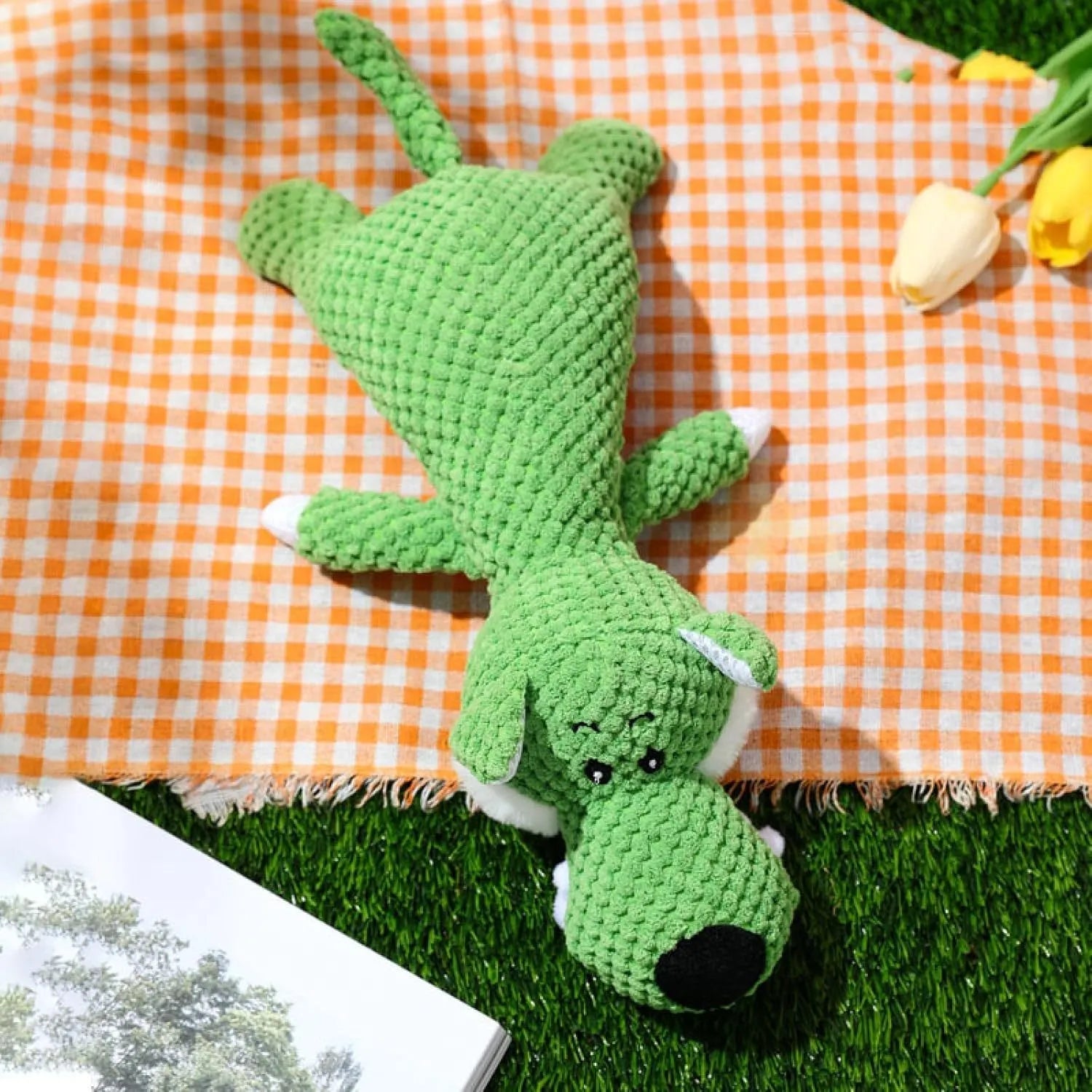 Interactive plush dog chew toy with corn kernel texture and squeaker in grey colour.