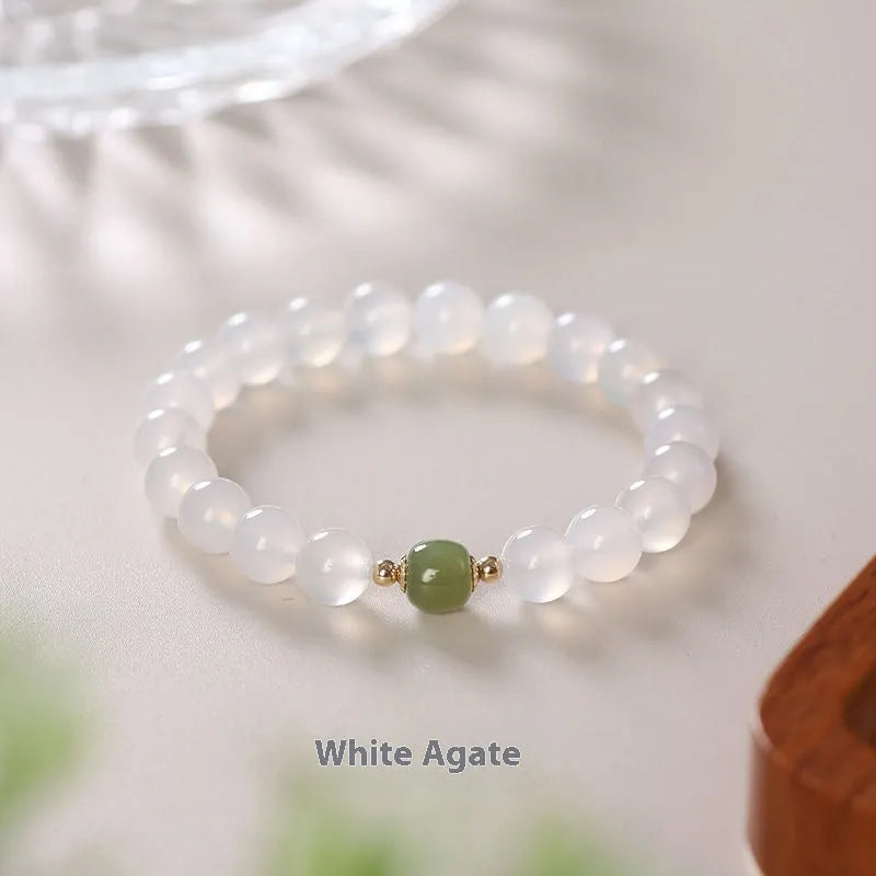 Handmade white agate bracelet with Hetian Jade and Cinnabar inlays showing 6mm and 8mm bead options