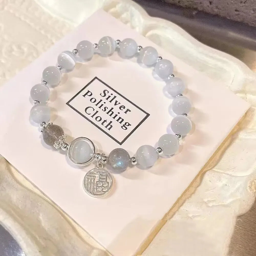 Handcrafted glass butterfly bracelet with drop-shaped moonlight grey beads and special-interest design