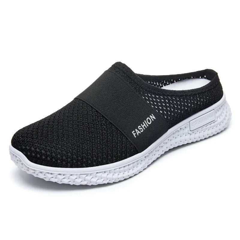Women's casual breathable mesh shoes with hollow-out design and flat heel in black, gray, pink, or purple.