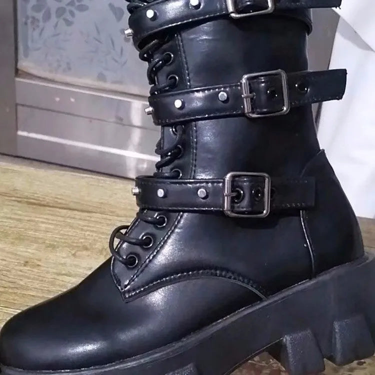 Women's black mid-calf knight boots with a metal buckle strap and side zipper.