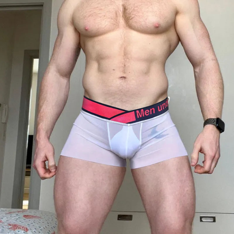 Men's black seamless low-waist underwear with a gradient laser design detail on the front.