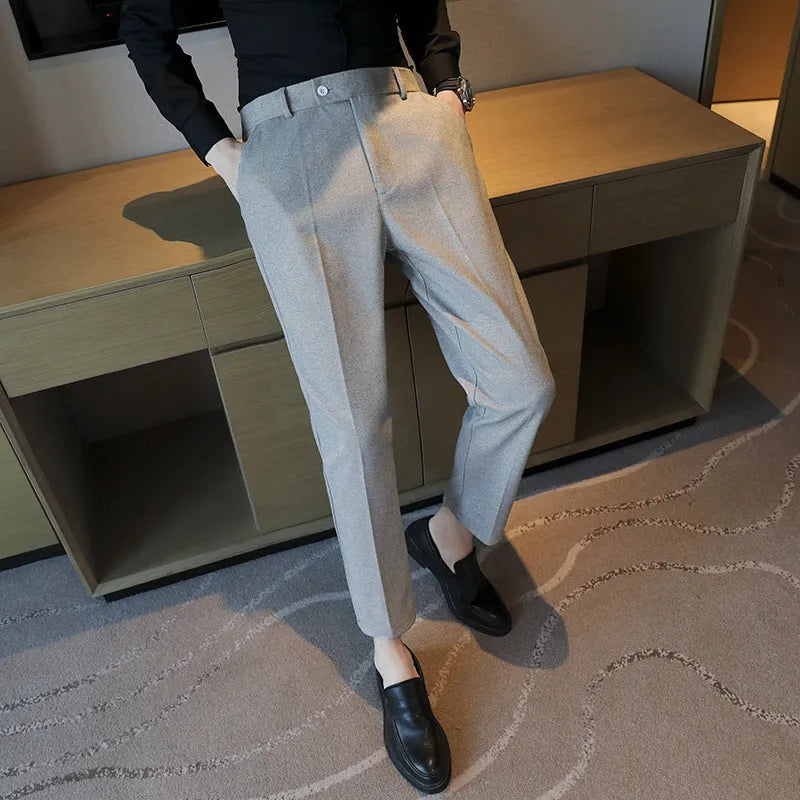 Men's straight fit brown corduroy trousers with elastic waistband on hanger