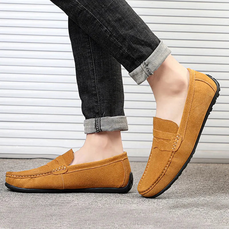 Men's suede loafers in black, blue, dark blue, wine red, and yellow colours showing round toe and flat sole