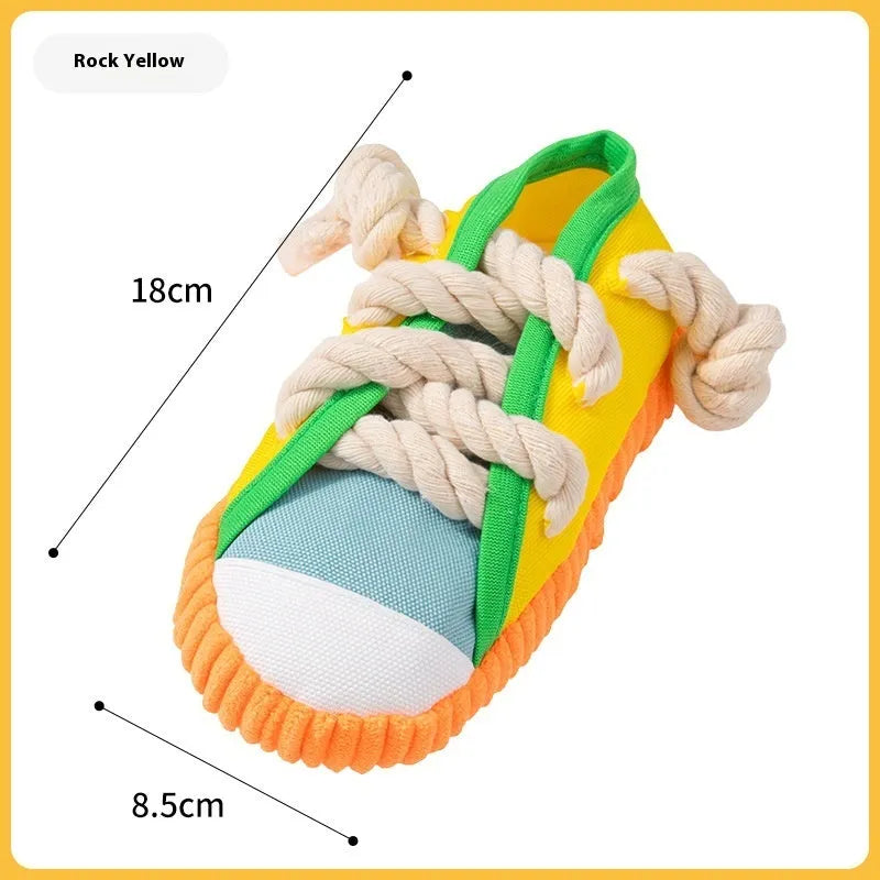 Plastic dog slipper chew toy in yellow, black and blue colours with textured bends for dental cleaning