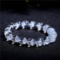 Women's white crystal pyramid bracelet with Ruyi design elements showing pyramid shapes and adjustable sizing