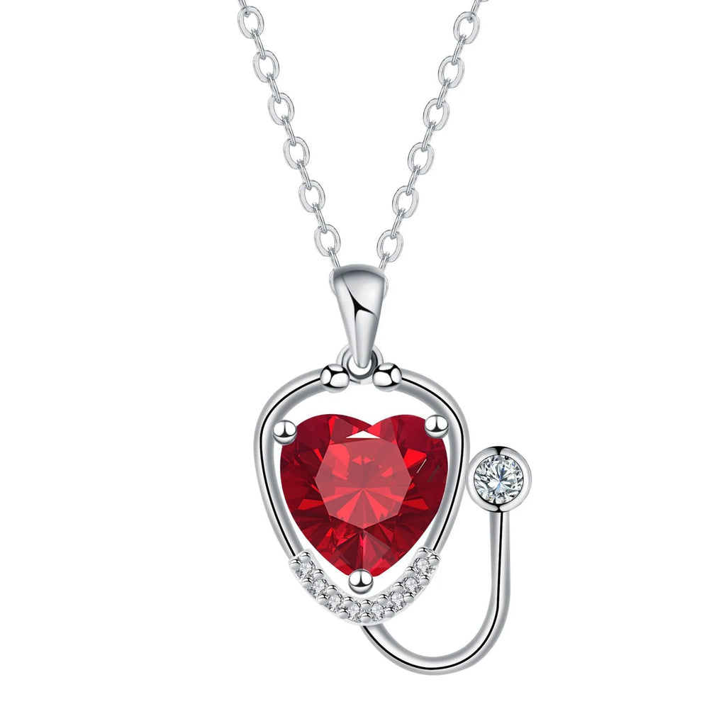 Women's fashion necklace with stethoscope and wing design in red diamond electroplated finish on copper