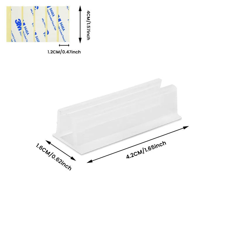 Set of sticky plastic wall-mounted brackets for punch-free bedside data cable organisation