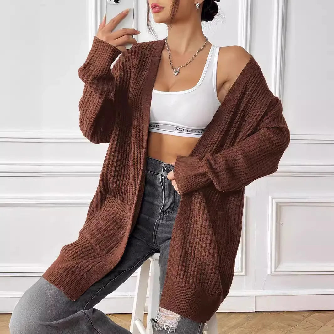 Women's mid-length loose fit cardigan with double pockets in dark green colour