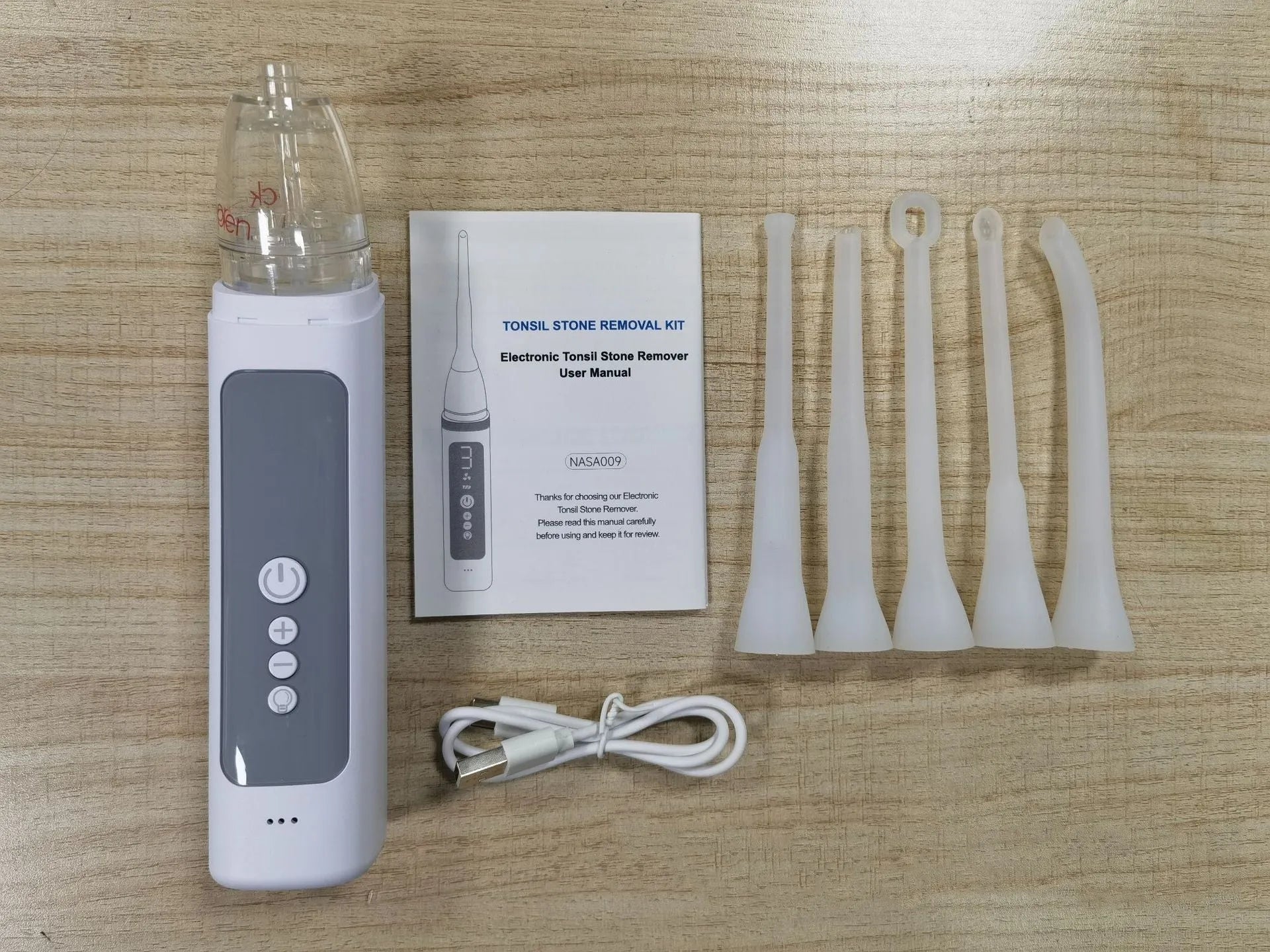 Milky white oral hygiene tool for tonsil stone and dental calculus removal.
