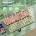 Matcha green mechanical gaming keyboard with white backlighting, aluminium panel, and multifunction knob on desk