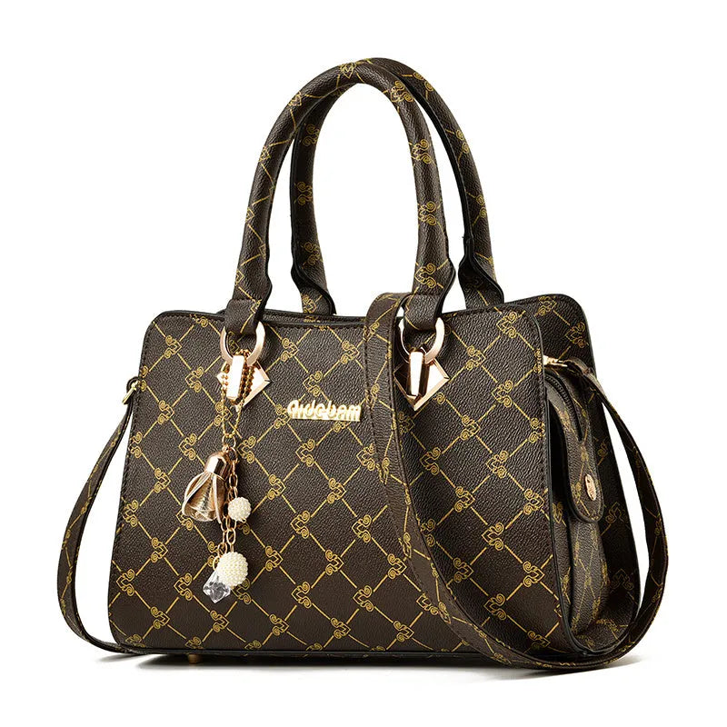 Women's geometric print messenger bag in PU material with internal organisation pockets and zipper closure