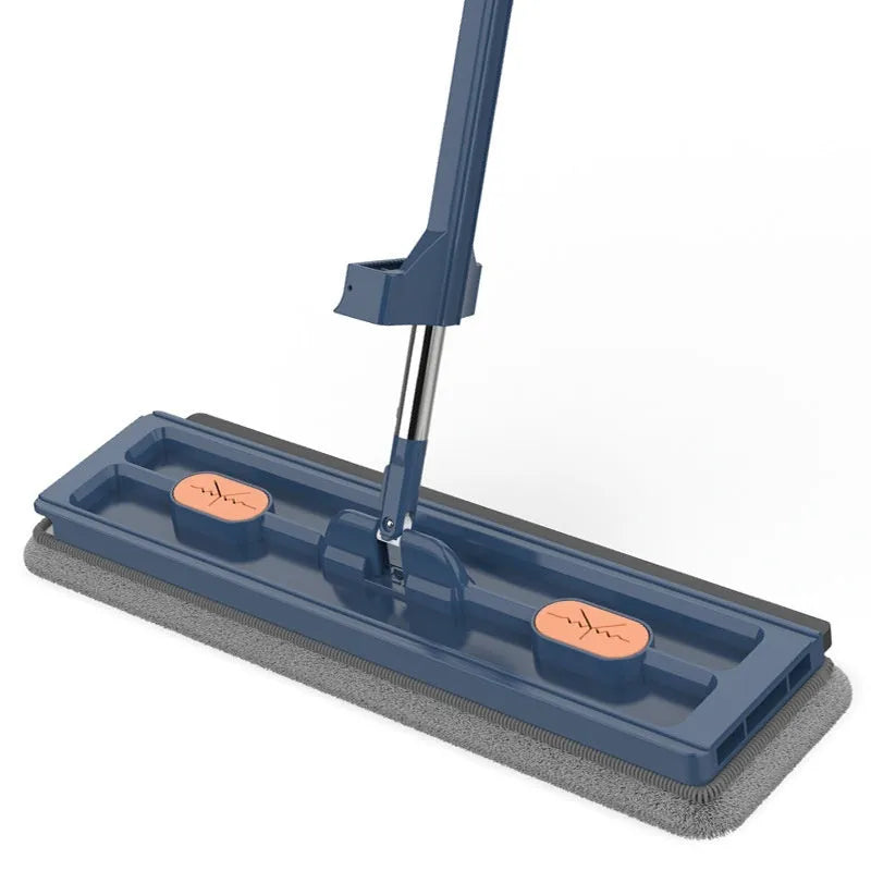 Large flat mop with blue cloth on a wooden floor, showing its 360-degree rotating head and long stainless steel handle.