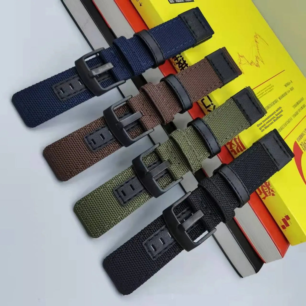 Oxford cloth canvas watch strap in army green colour showing textured fabric and buckle.