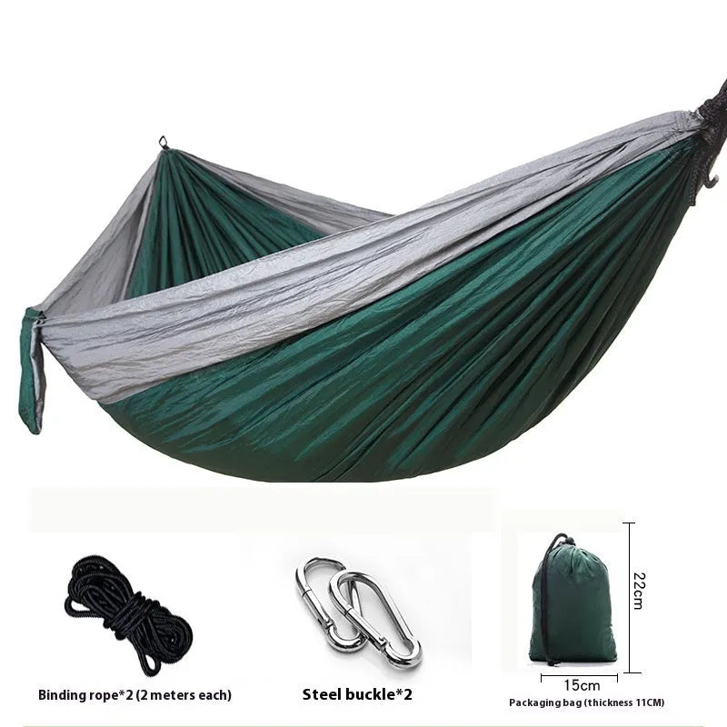 Double camping hammock with ropes and buckles shown in outdoor setting