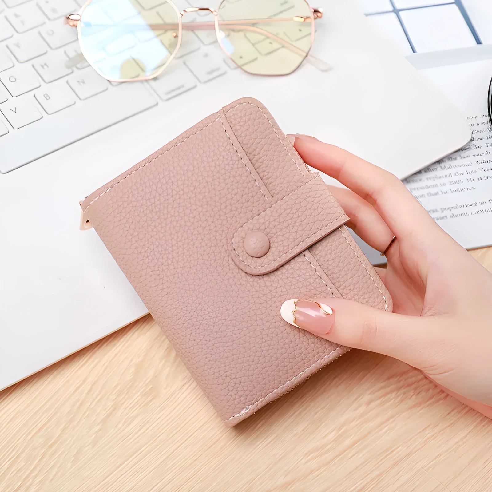 Ladies short pu leather wallet with lychee pattern in beige, showing two-fold design with card slots.