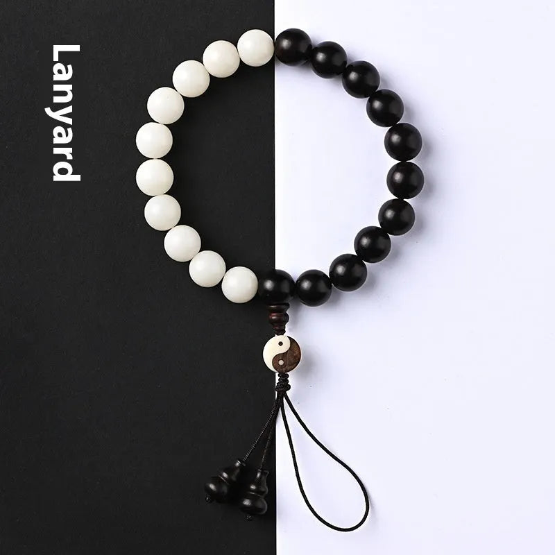 Handcrafted Bodhi seed bracelet with white Corypha Umbraculifera and Blackwood beads in eight-diagram pattern