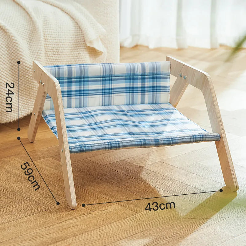 Blue wooden elevated cat bed with fabric hammock for indoor feline lounging