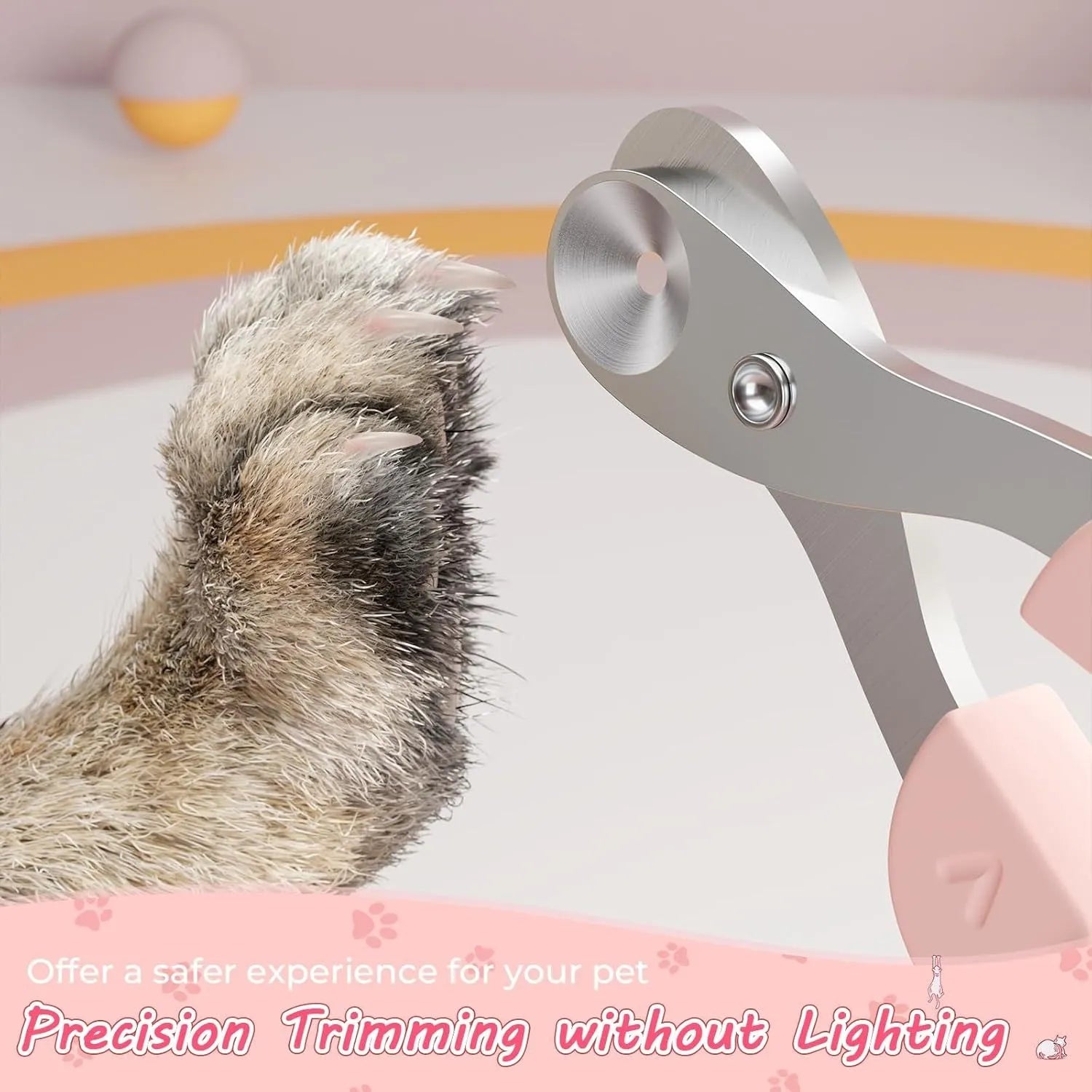 Close-up of a pink pet nail clipper showing the round positioning hole and stainless steel blade.