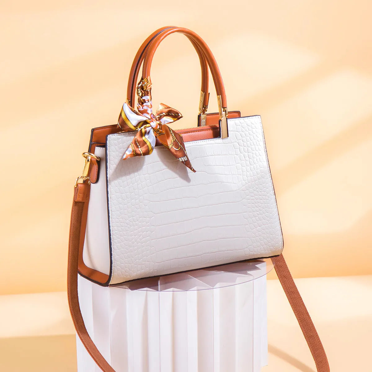 Milky white women's shoulder handbag with internal organisers and urban style sewing detailing