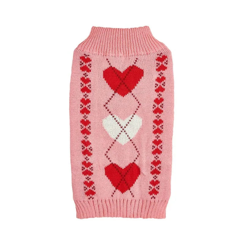 Red love heart design dog sweater on a small dog, showing acrylic knit fabric and playful motif.