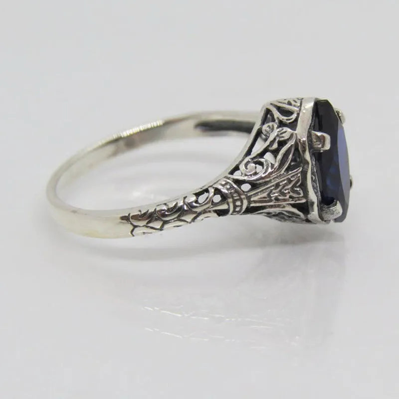 Silver women's geometric hollow ring with zircon detailing on finger