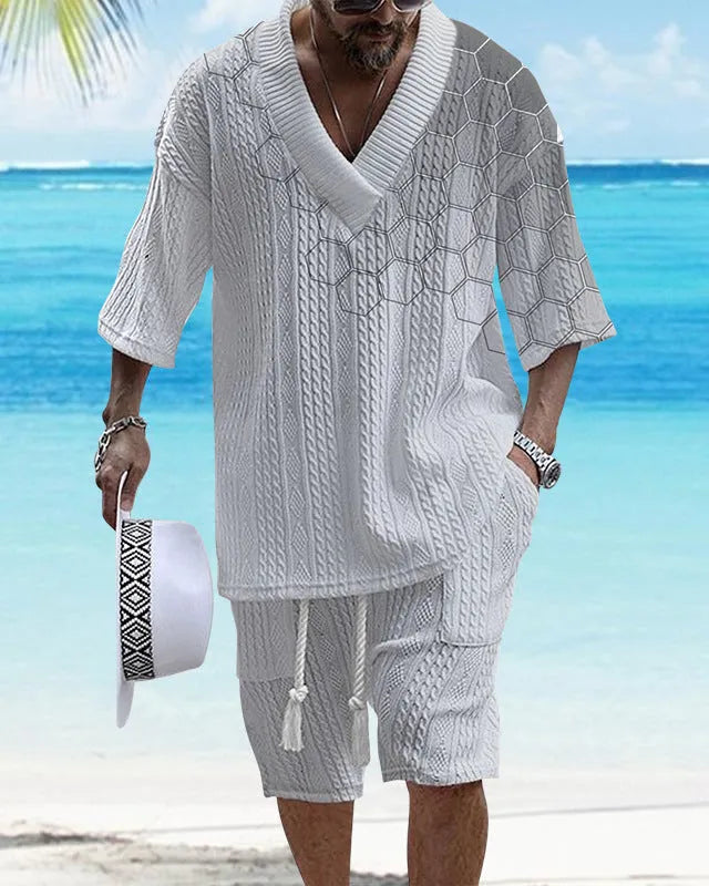 Printed men's knitted drop-shoulder short-sleeved top and matching shorts set in a polyester blend.