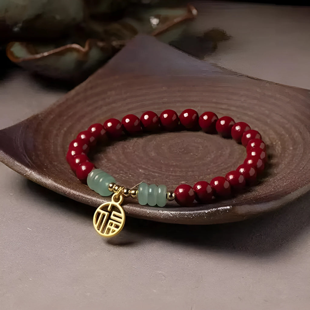 Gold cinnabar and copper wave bracelet in pumpkin or brand colour on wrist.