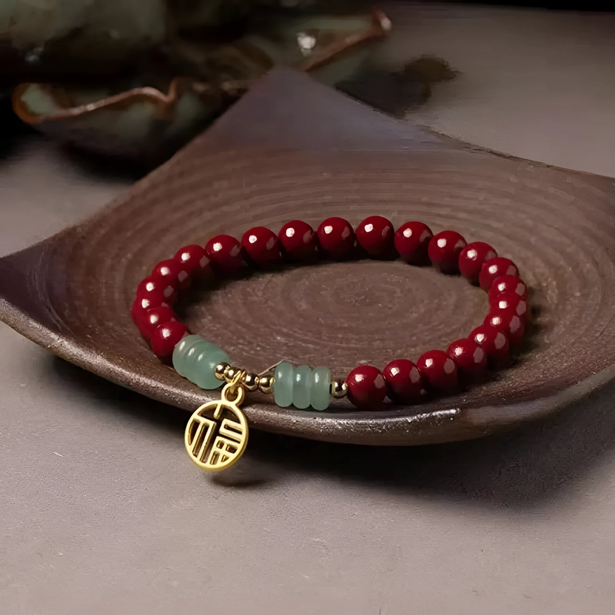 Gold cinnabar and copper wave bracelet in pumpkin or brand colour on wrist.