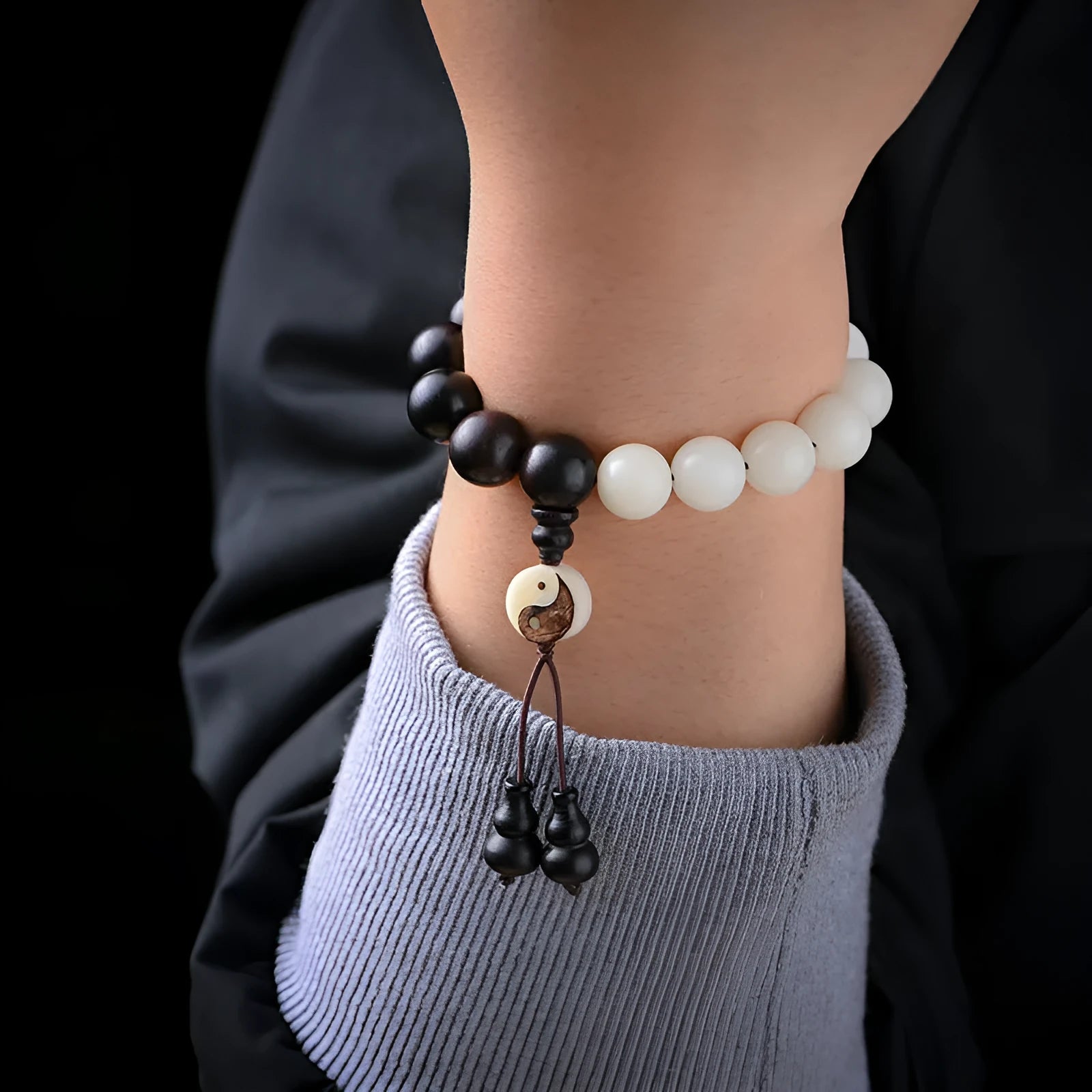 Handcrafted Bodhi seed bracelet with white Corypha Umbraculifera and Blackwood beads in eight-diagram pattern