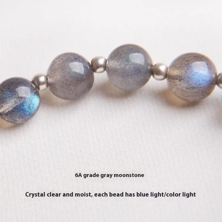 Grey moonlight gemstone women's bracelet with 7.5mm beads and a sterling silver honeysuckle charm.