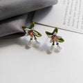 Alloy camellia flower earrings with sterling silver needle detailing for women