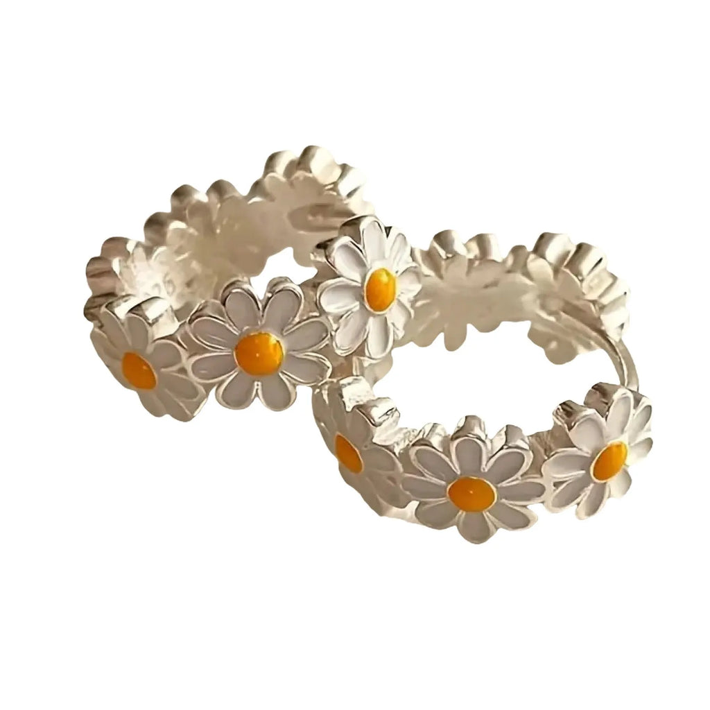 White platinum electroplated daisy flower ring earrings with K-platinum gem accents on a copper base.