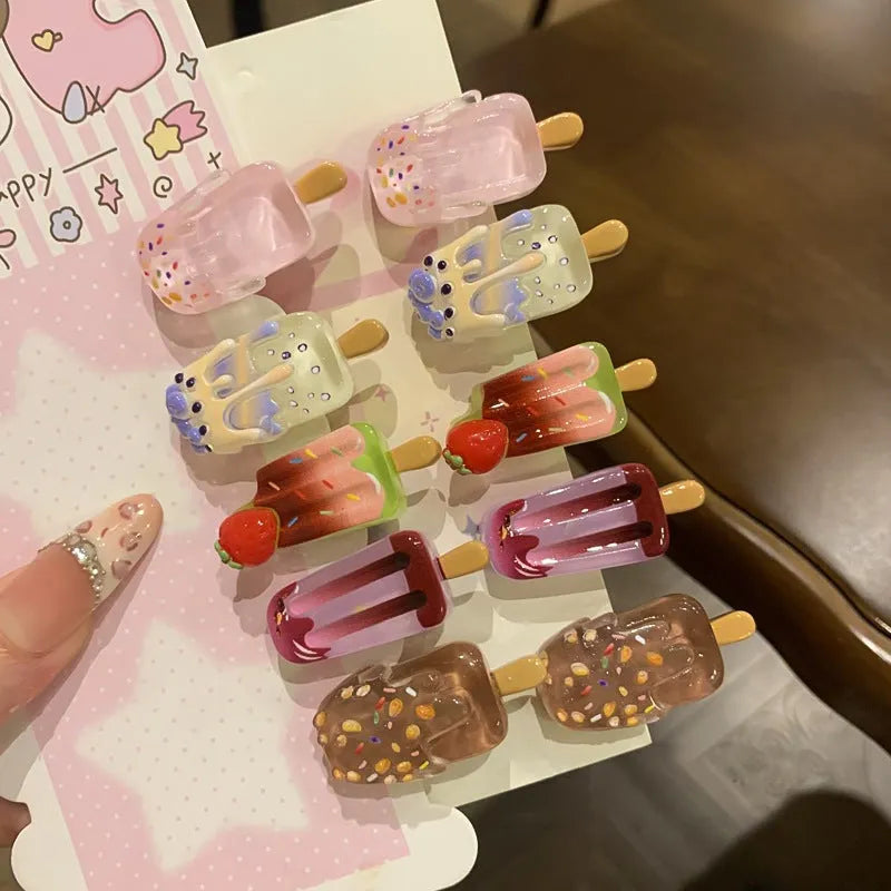 Resin ice cream design hair barrette with side clip fastening.