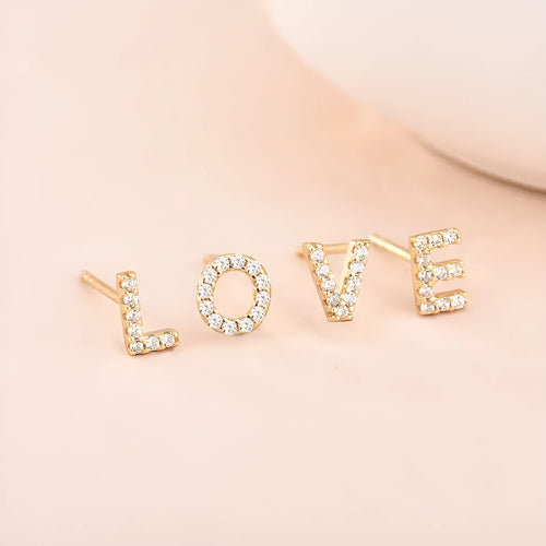 Brass gold plated alphabet earrings showing zircon letter detailing on copper base with gold plating