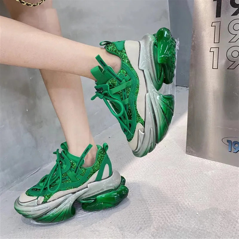 Women's leather sports shoes with a thick jelly sole and white cross-tie fastening on a round toe.