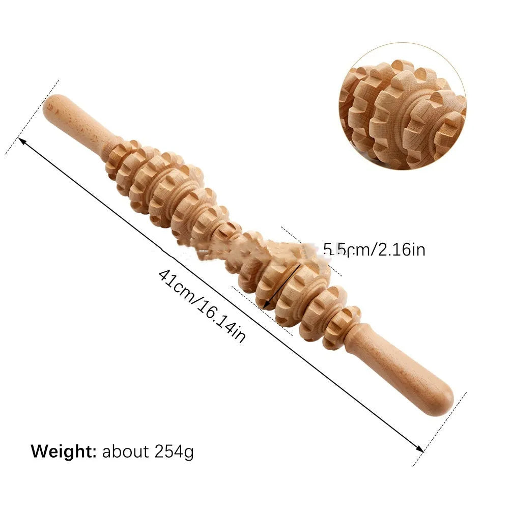 Assorted beech wood massage rollers including T-shaped and multi-wheel sets on a plain surface.