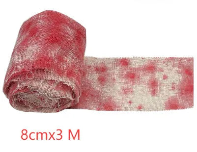 Roll of red Halloween horror gauze bandage with bloody dye effect, 8cm wide.