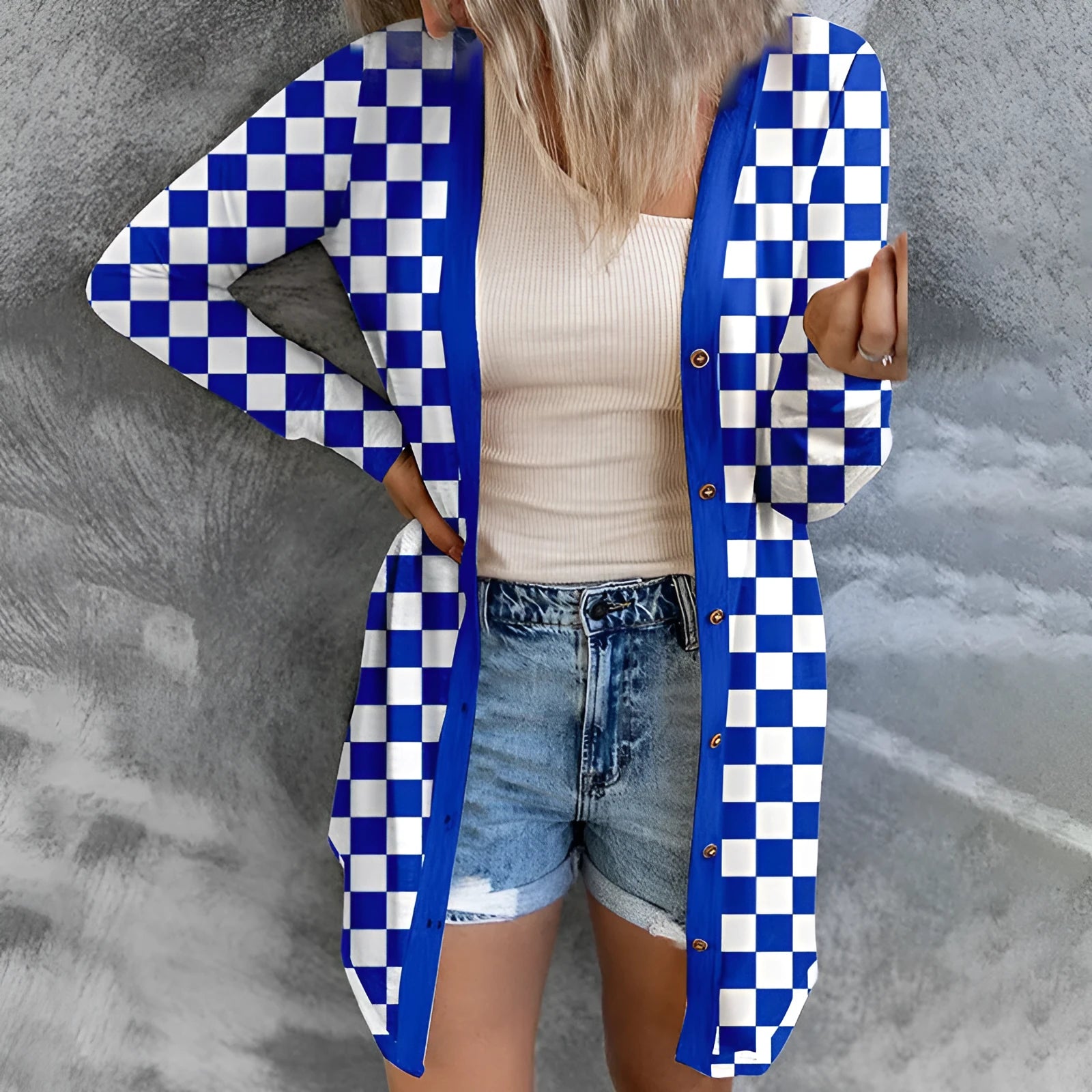 Women's long grey plaid knitted coat cardigan with contrasting colour blocks, loose fit, and regular sleeves.