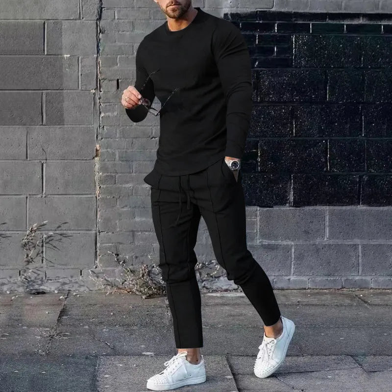 Men's solid colour two-piece polyester tracksuit with long sleeves, shown in apricot colour.