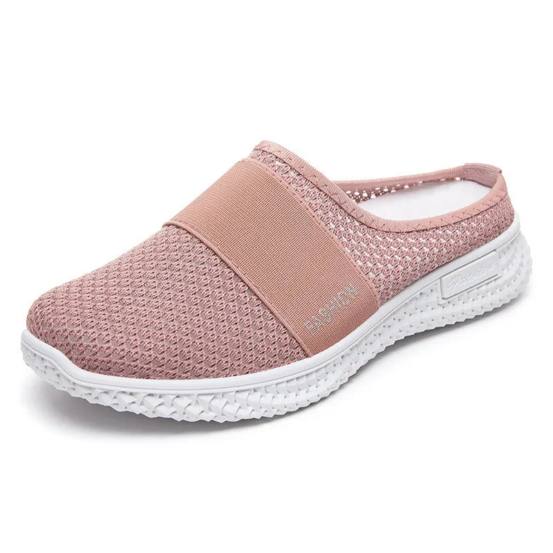 Women's casual breathable mesh shoes with hollow-out design and flat heel in black, gray, pink, or purple.