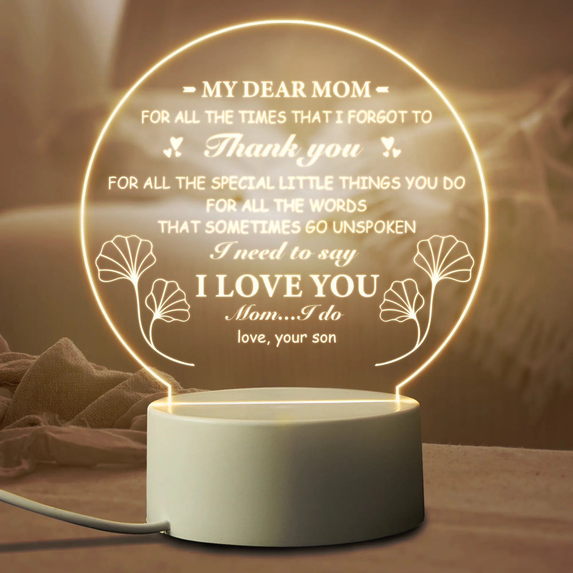 Modern white bedside night light with acrylic shade on ABS base, connected via USB cable.